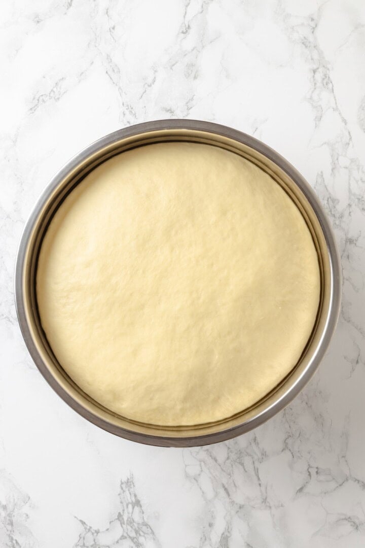 Soft, gooey and sticky, this Vegan Monkey Bread recipe is an irresistible pull-apart treat that's perfect for weekend brunches and holidays! Monkey bread dough in bowl after first rise.