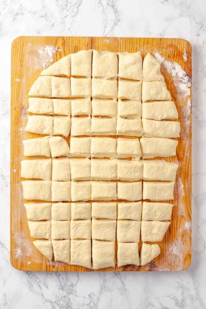 Soft, gooey and sticky, this Vegan Monkey Bread recipe is an irresistible pull-apart treat that's perfect for weekend brunches and holidays! Dough cut into 50 small portions.