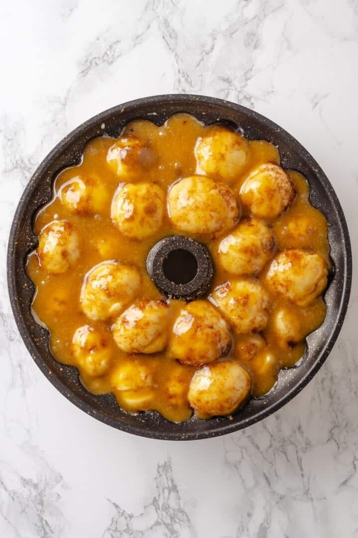 Soft, gooey and sticky, this Vegan Monkey Bread recipe is an irresistible pull-apart treat that's perfect for weekend brunches and holidays! Monkey bread in bundt pan before baking.