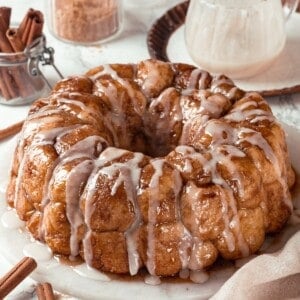 Glazed vegan monkey bread on marble serving platter.