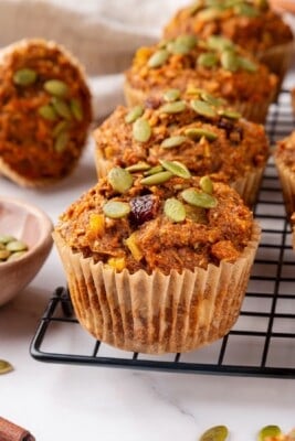 Vegan morning glory muffins on wire rack.
