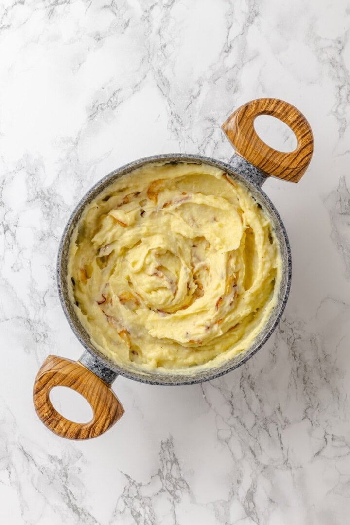 This vegan pierogi casserole layers a cheesy potato filling with lasagna noodles for pierogi vibes without the work of making dumplings! Pierogi filling in pot.