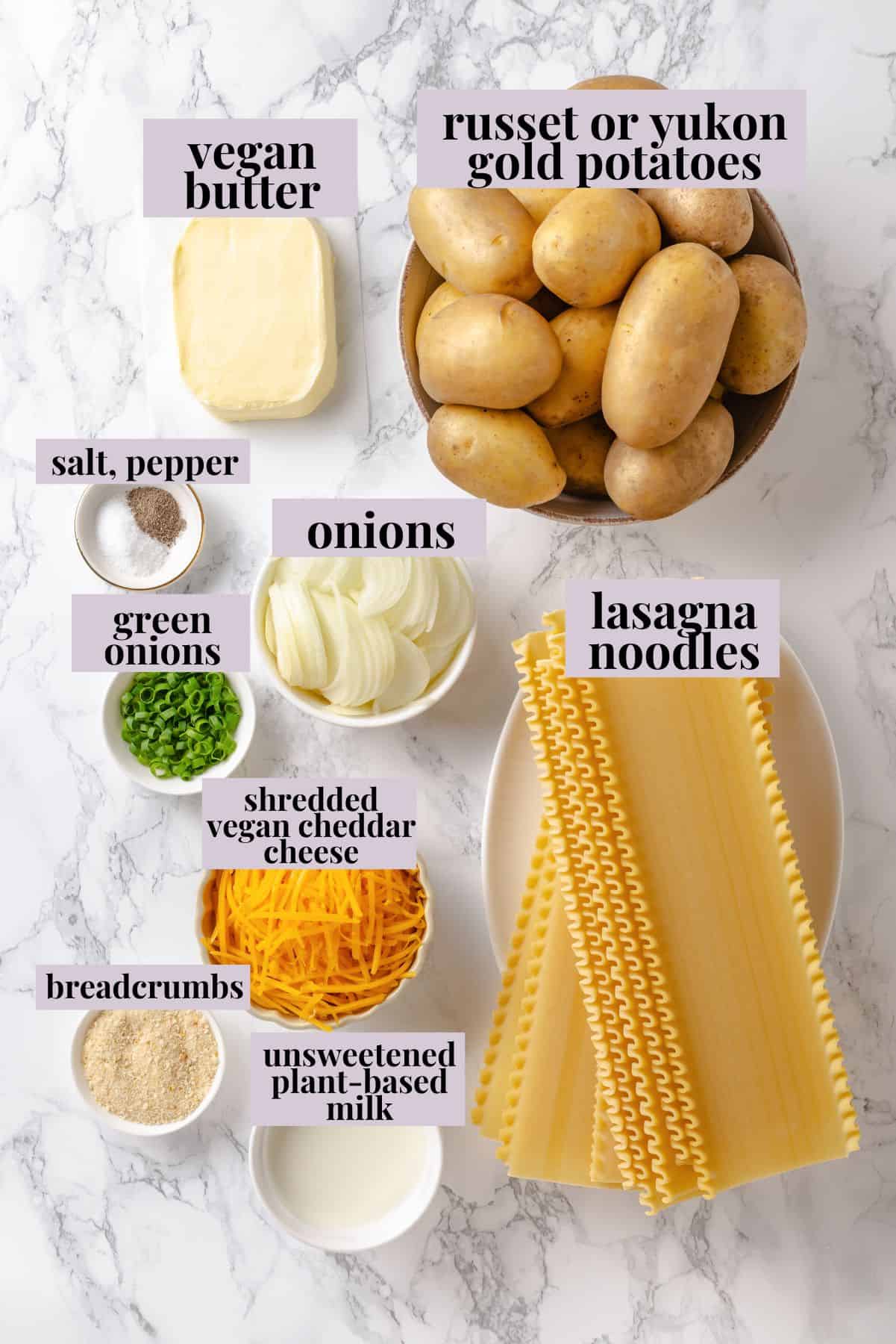 This vegan pierogi casserole layers a cheesy potato filling with lasagna noodles for pierogi vibes without the work of making dumplings! Ingredients for pierogi casserole with labels.
