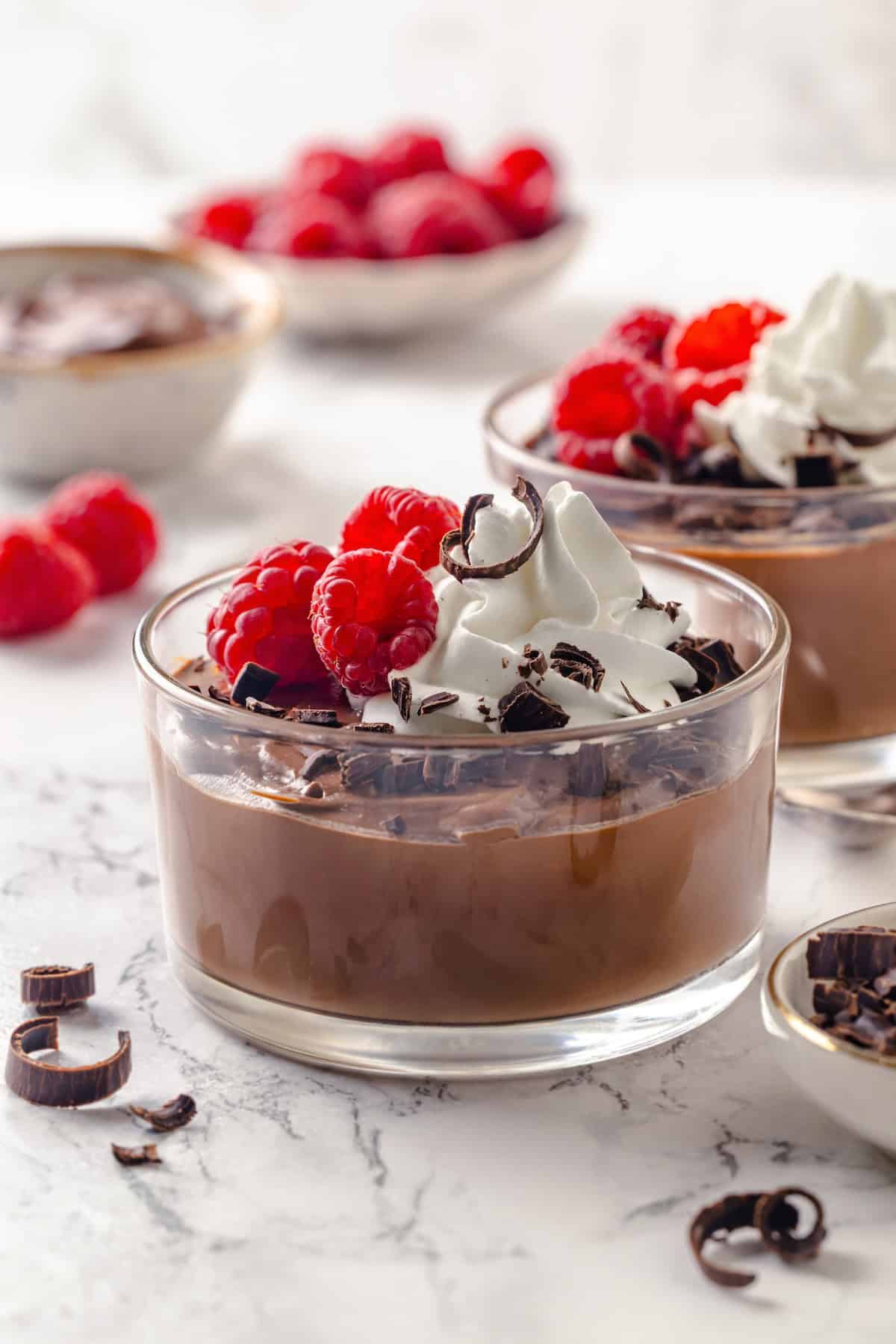 Silken Tofu Chocolate Mousse is the easiest vegan dessert you'll ever make! It's rich and indulgent, with a velvety smooth texture. So good! Vegan chocolate mousse made with silken tofu in two glass bowls.