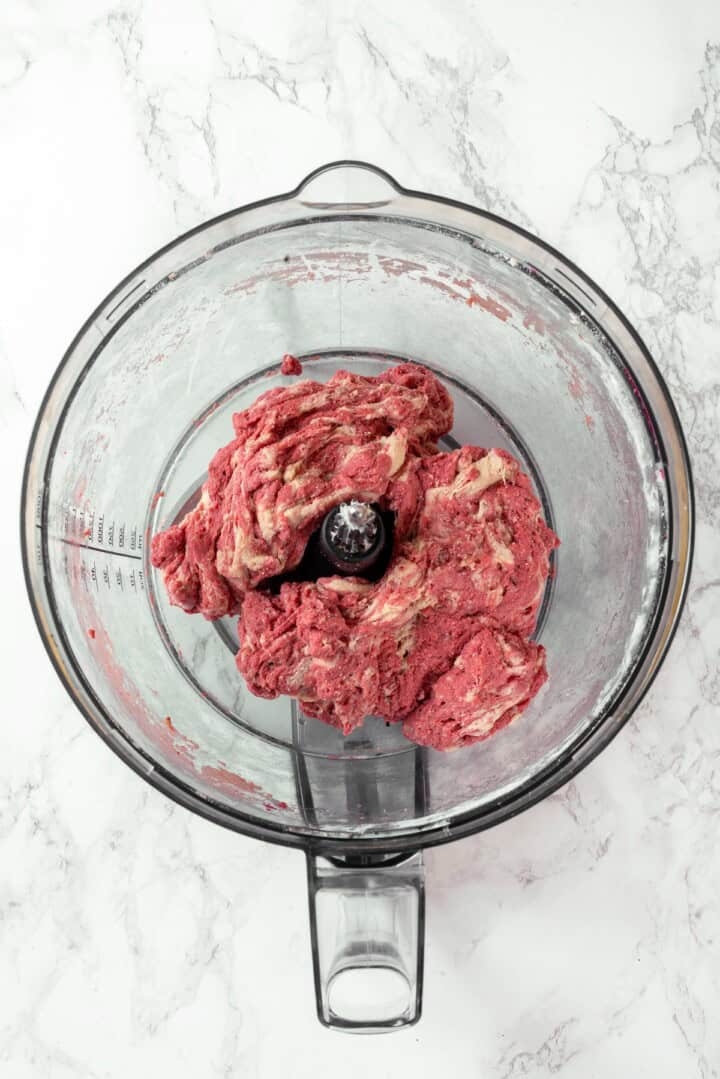 This easy vegan salami recipe is smoky, savoury and sliceable, just like the real deal! Perfect for sandwiches and charcuterie boards. Red and white salami dough mixed in food processor.