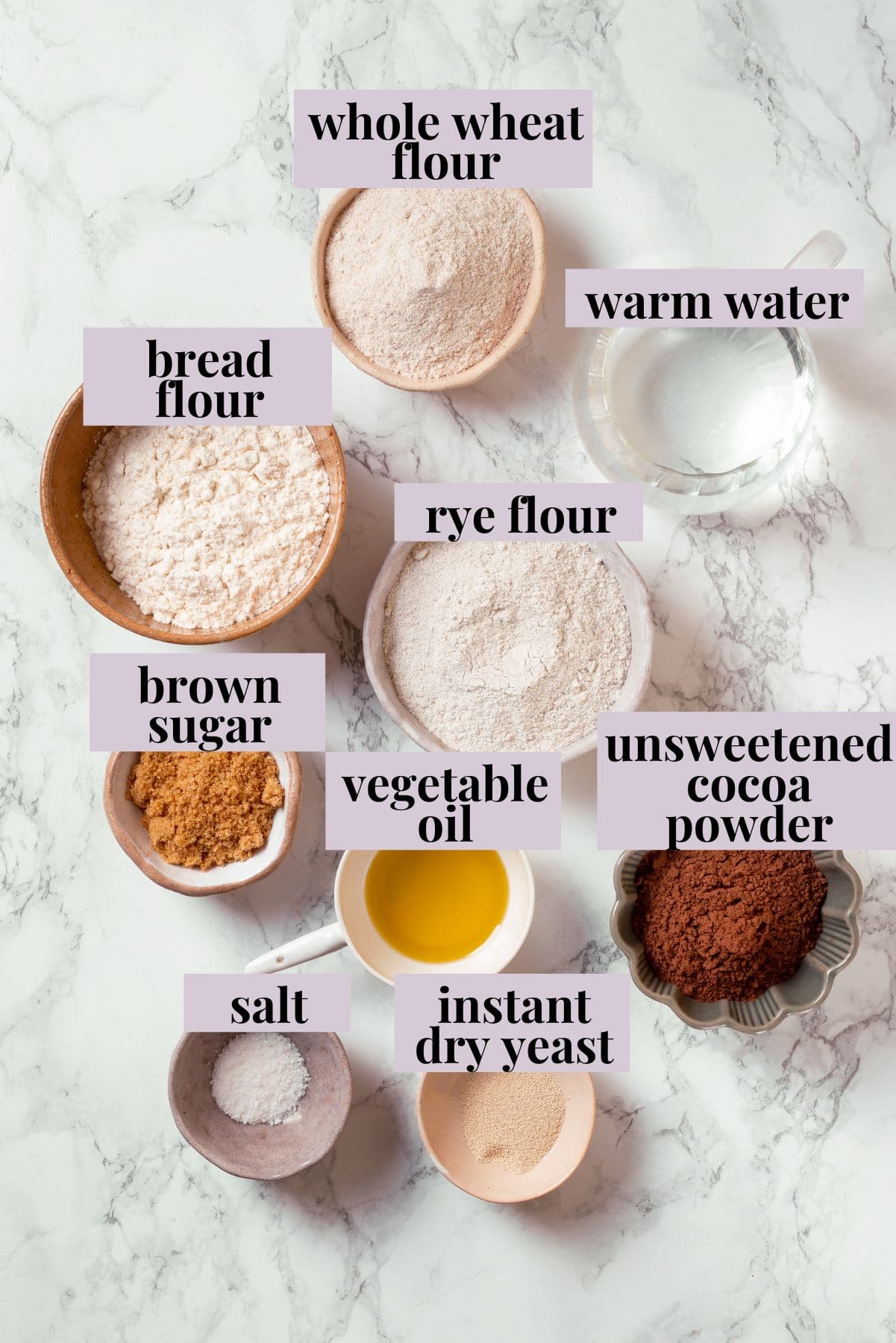 This no-knead dark pumpernickel bread has rich rye flavour and cocoa undertones, perfect for sandwiches and toast. It's so easy to make too! Ingredients for pumpernickel bread with labels.