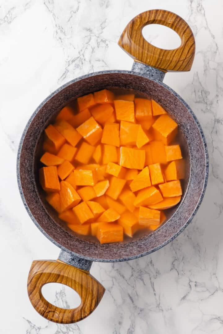 These fudgy vegan sweet potato brownies are made with maple syrup and cocoa for a treat that’s naturally sweet, gluten-free, and oh so rich! Sweet potatoes in pot of water.