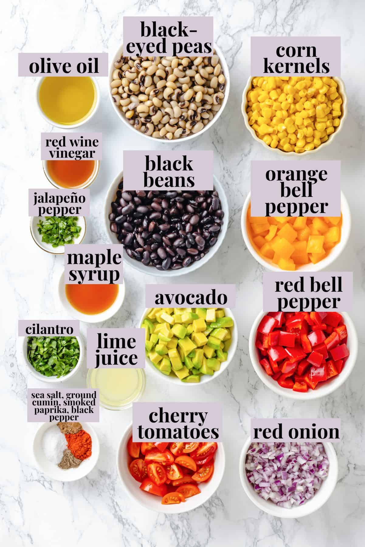 This cowboy caviar recipe is made with black-eyed peas, black beans, avocado, veggies, and a zesty dressing. Use it as a dip or a side dish! Ingredients for cowboy caviar recipe with labels