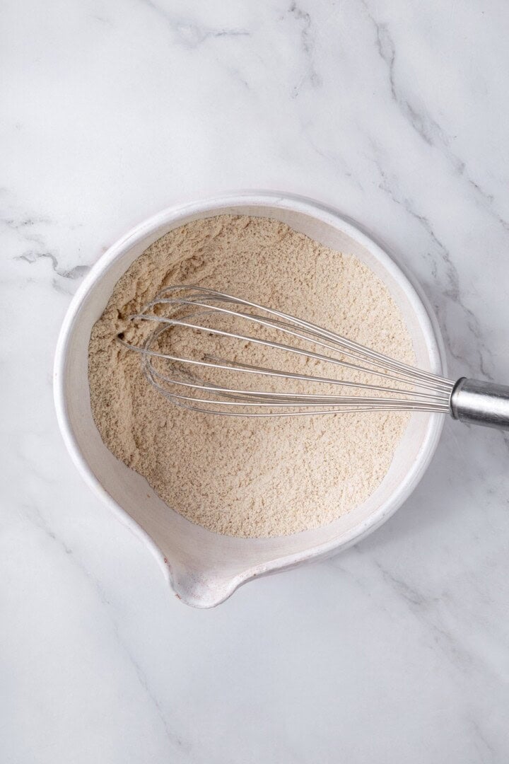 These oat flour pancakes are thick and fluffy, made with simple ingredients and they're naturally gluten-free and vegan. A game changer! Whisk in bowl of dry ingredients.