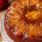 Vegan upside down apple cake on serving plate.