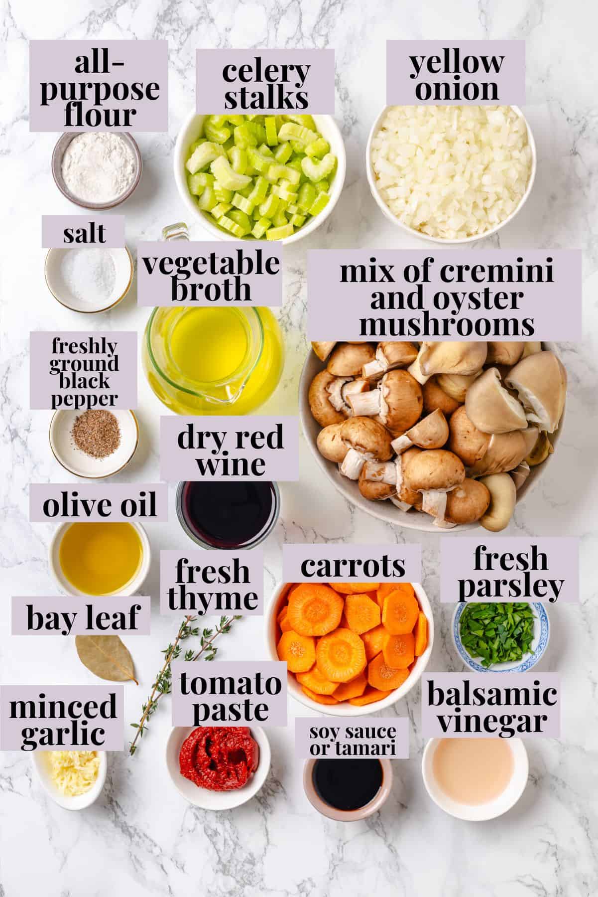 Mushroom bourguignon is a rich, savoury vegan stew simmered in red wine with herbs and meaty mushrooms. A cozy yet elegant meal! Ingredients for mushroom bourguignon with labels.