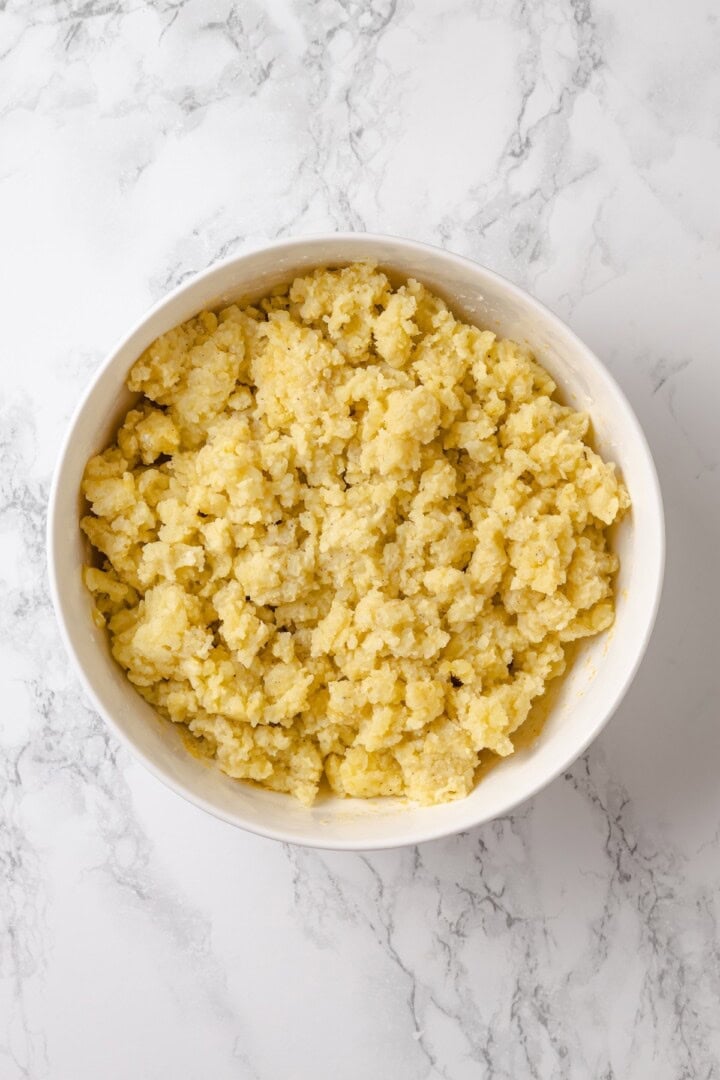 These homemade tater tots are crispy outside, fluffy inside and made with real potatoes. Bake, fry, air fry or freeze them for later! Potato mixture for homemade tater tots.