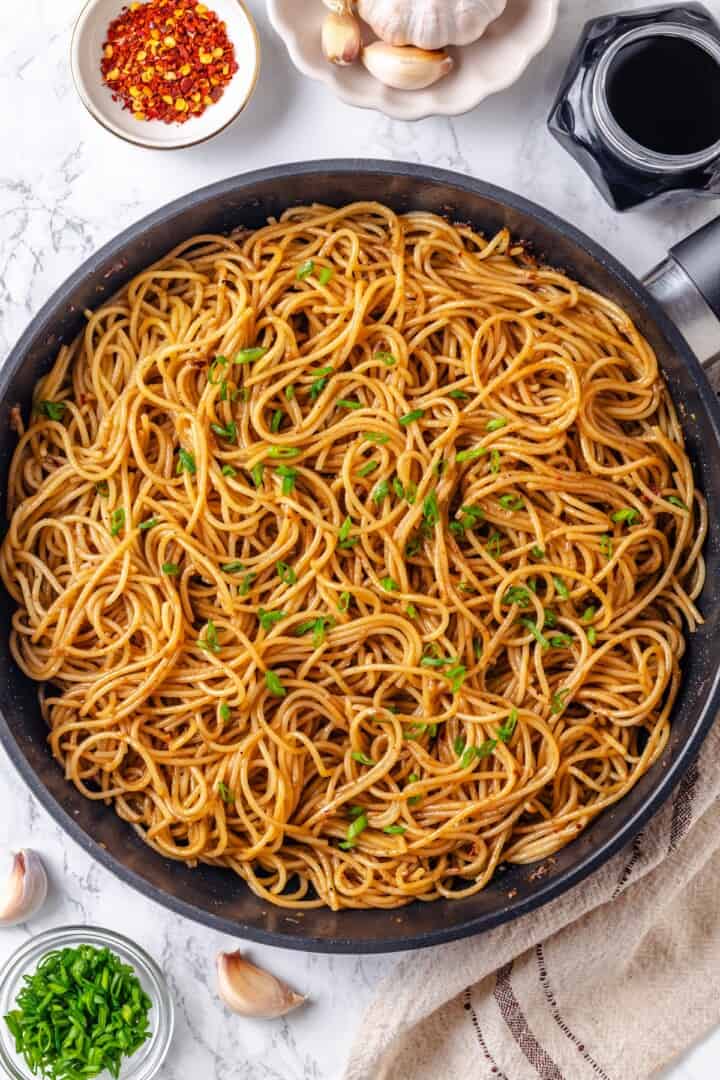 These vegan garlic noodles deliver bold, buttery garlic flavour in a quick, satisfying dish that’s ready in just 20 minutes! Skillet of garlic noodles.