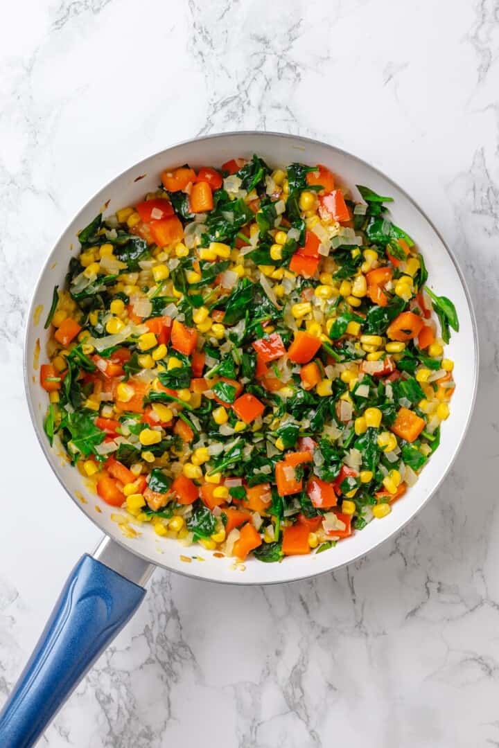 Cooked vegetables in skillet.