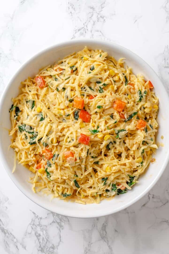 Potato and veggie mixture for loaded hashbrown casserole.