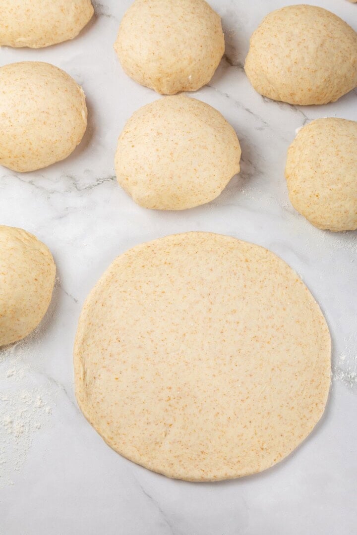 Tender and warm, with a perfect pocket in the middle, this easy homemade pita bread recipe gives your wraps, dips and sandwiches an upgrade! Dough rolled into circle.