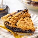 Vegan shoofly pie slice on plate with fork.