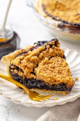 Vegan shoofly pie slice on plate with fork.