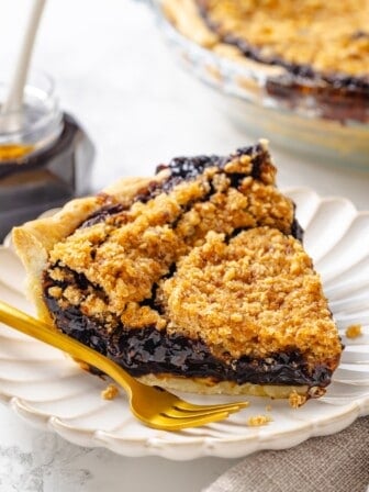 Vegan shoofly pie slice on plate with fork.