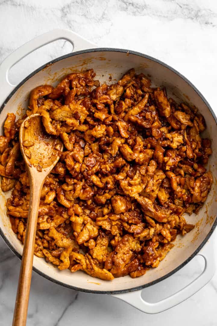 A little bit crispy, budget-friendly and packed with bold flavour, these BBQ soy curls are an easy vegan staple you’ll make again and again! BBQ soy curls in skillet with BBQ sauce.