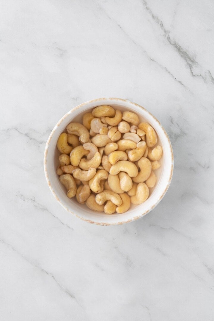 Cashews in bowl of water.