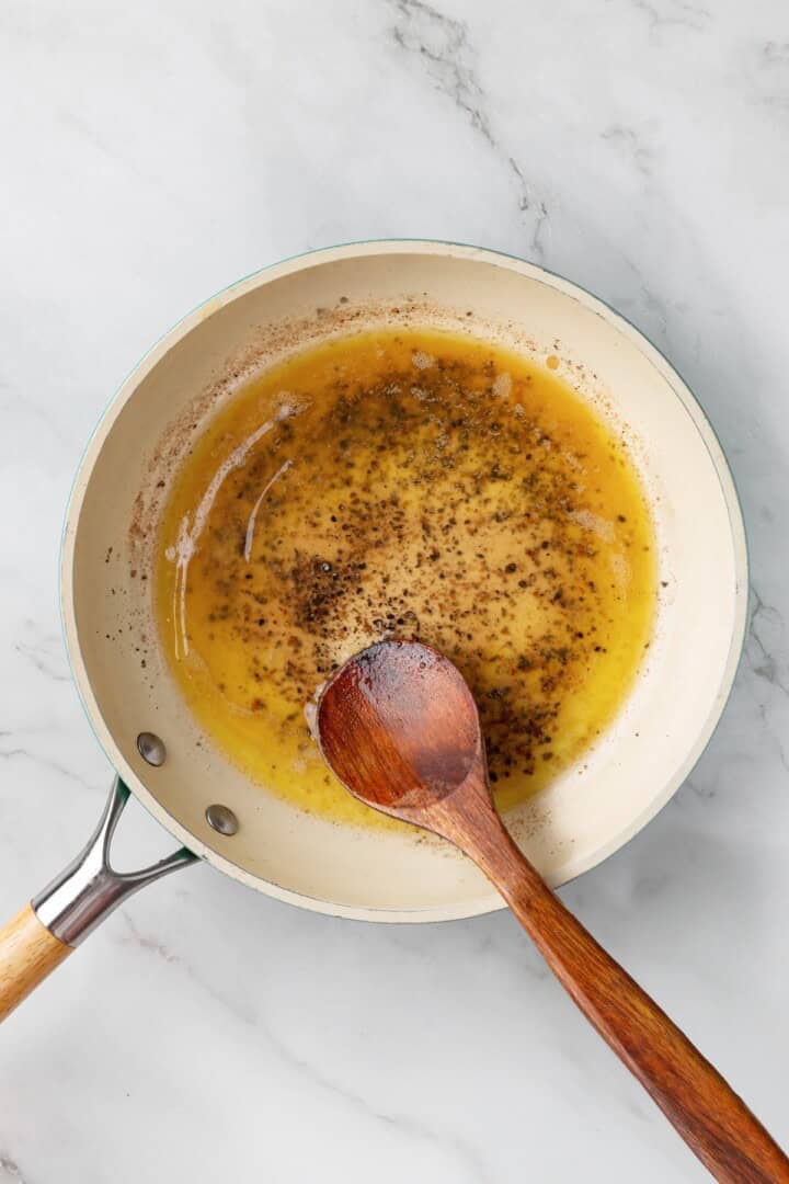 Melted butter and pepper in skillet.
