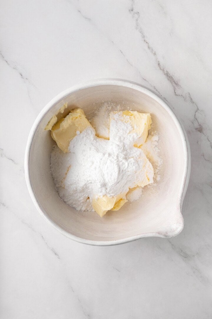 Buttery, melt-in-your-mouth and coated in powdered sugar, these vegan Mexican wedding cookies have everything you love about the original! Vegan butter and powdered sugar in bowl.