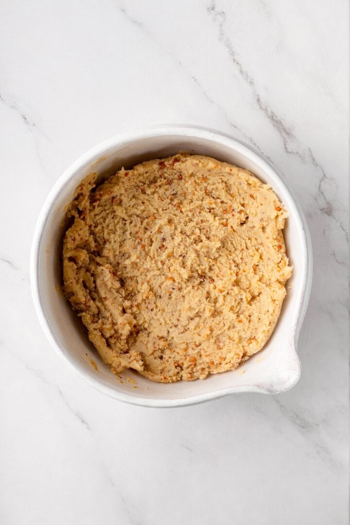 Buttery, melt-in-your-mouth and coated in powdered sugar, these vegan Mexican wedding cookies have everything you love about the original! Mexican wedding cookie dough in bowl.