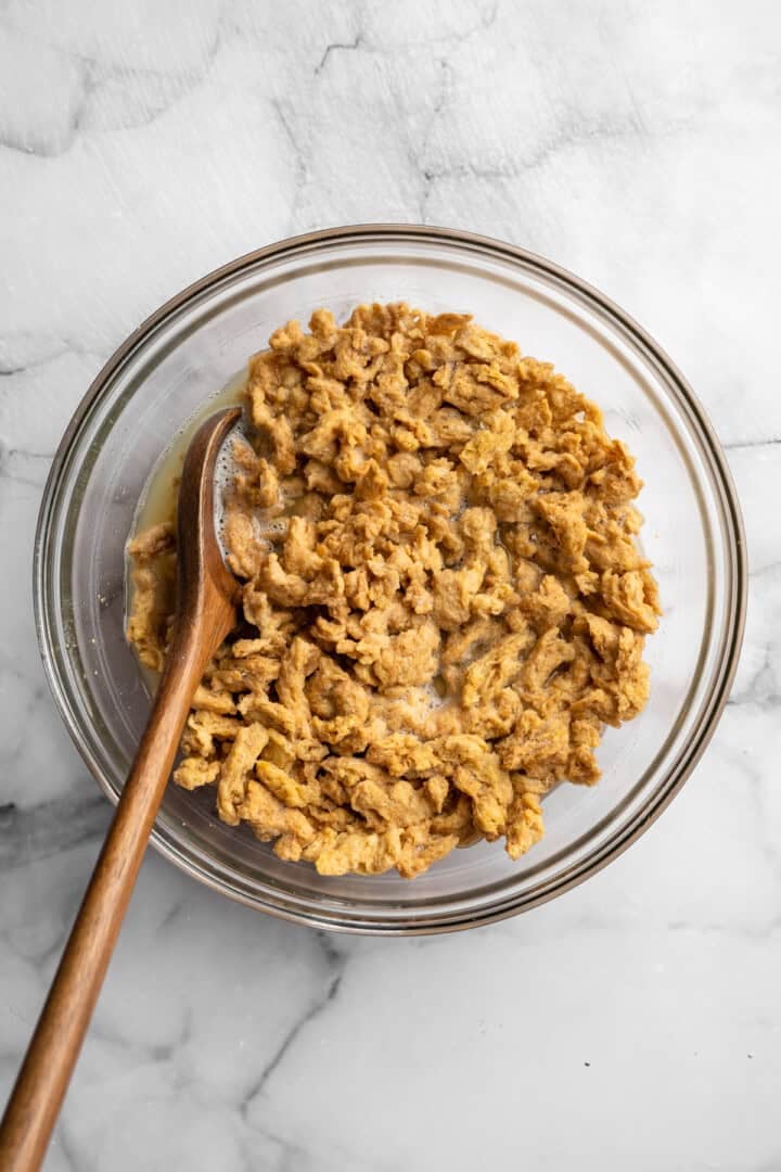 Soy curl "chicken" is a budget-friendly vegan swap for chicken that's crispy on the outside, full of savoury flavour, and super versatile! Soy curls soaking in broth.