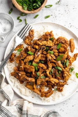 Soy curl chicken served on plate of rice.
