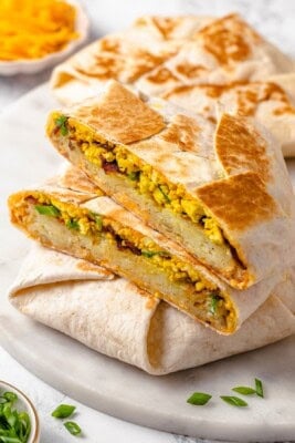 Vegan breakfast crunchwrap cut in half to show fillings.