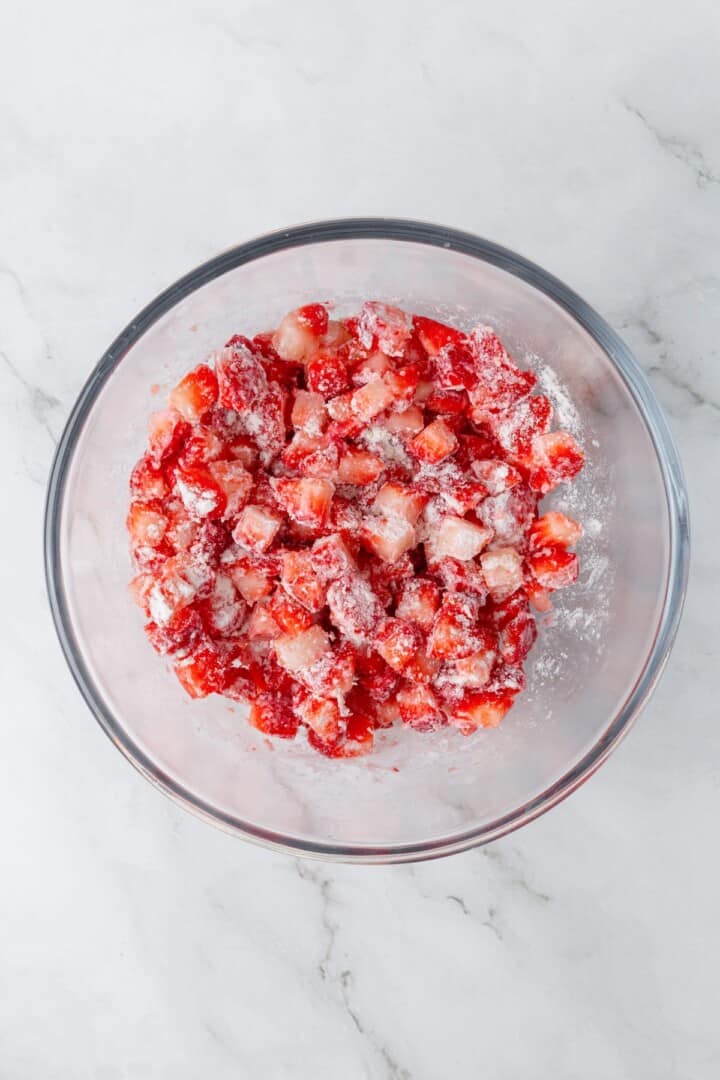 These Vegan Strawberry Muffins are top-notch. Tender, fluffy, and loaded with fresh fruit, they're the perfect way to start the day. Cubed fresh strawberries tossed with flour.