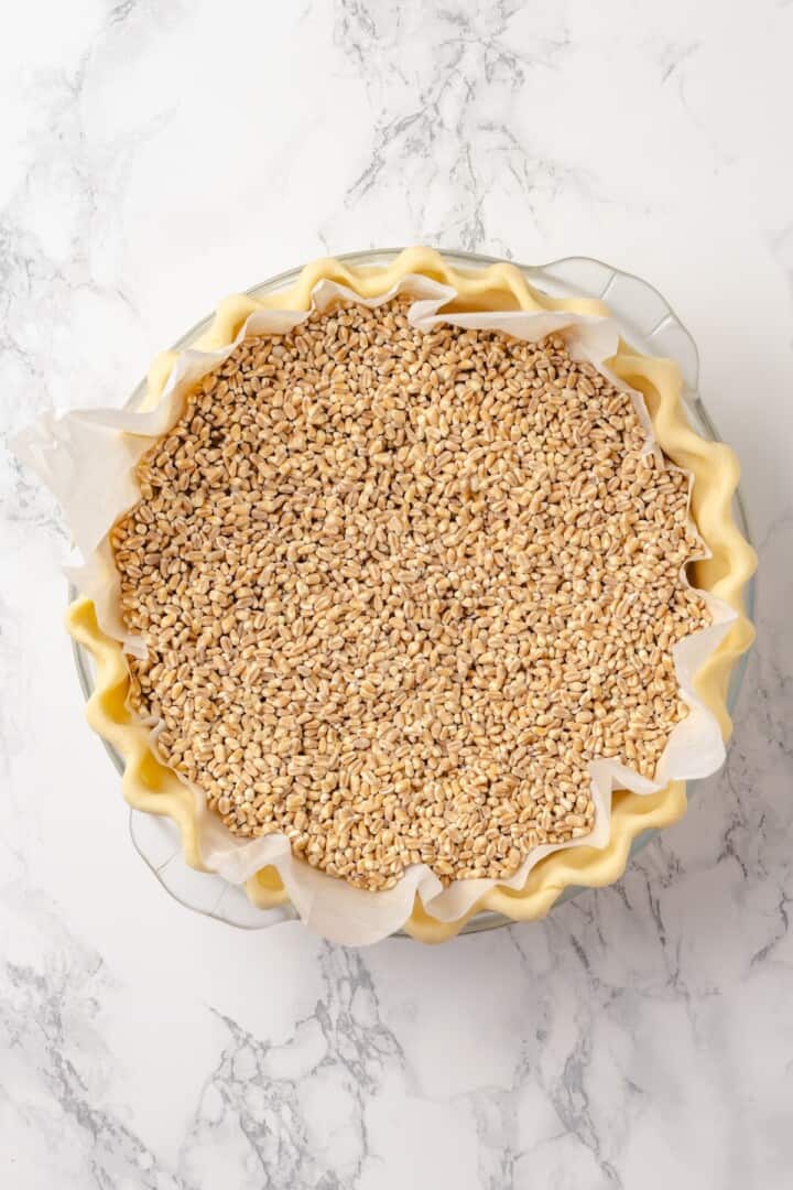 Pie crust in pan before baking.