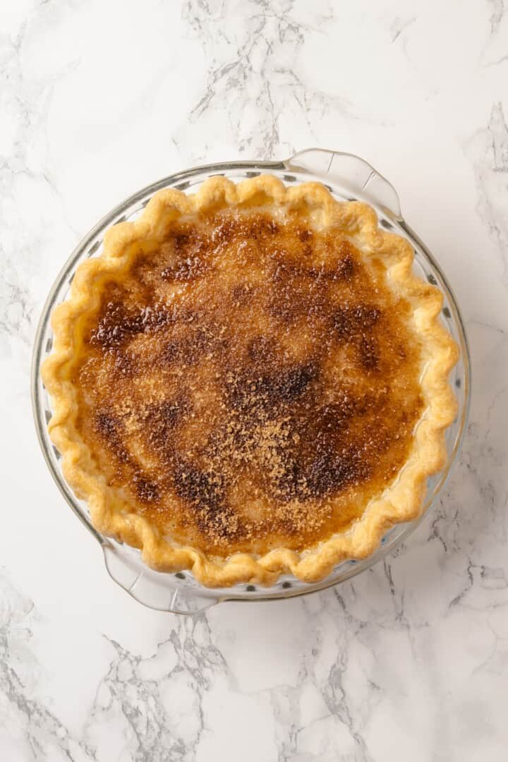 Vegan sugar cream pie in glass pie plate.
