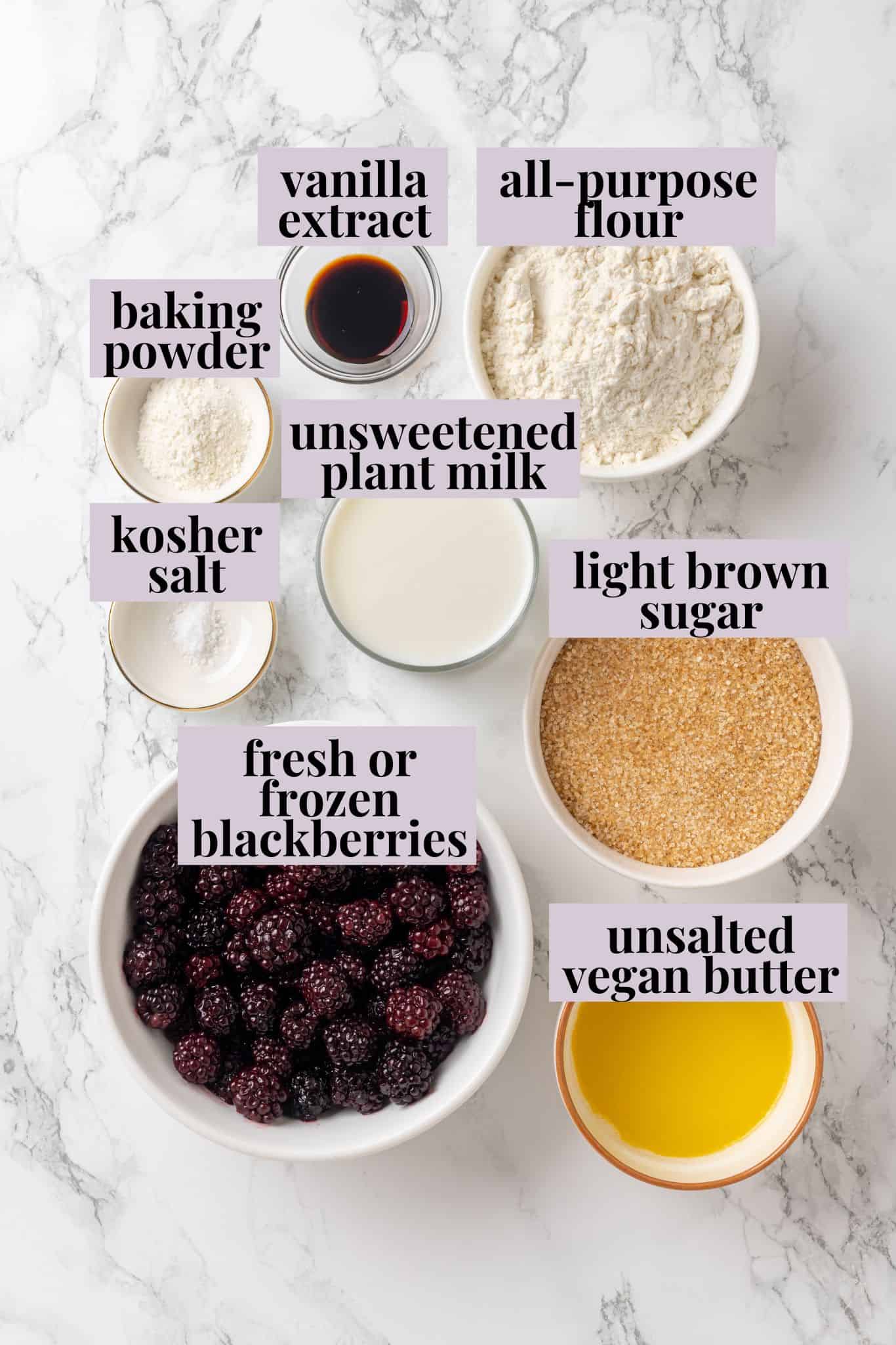 This blackberry cobbler, with its fluffy batter topping and juicy, bubbling blackberries is a summer staple you don't want to miss. Labeled ingredients for blackberry cobbler recipe.