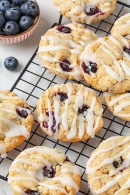 Close-up image of vegan blueberry lemon cookies on a cooling rack