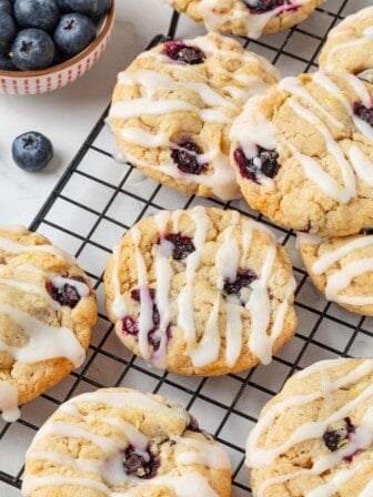 Close-up image of vegan blueberry lemon cookies on a cooling rack