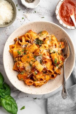 A serving of vegan pasta bake in a plate bowl.