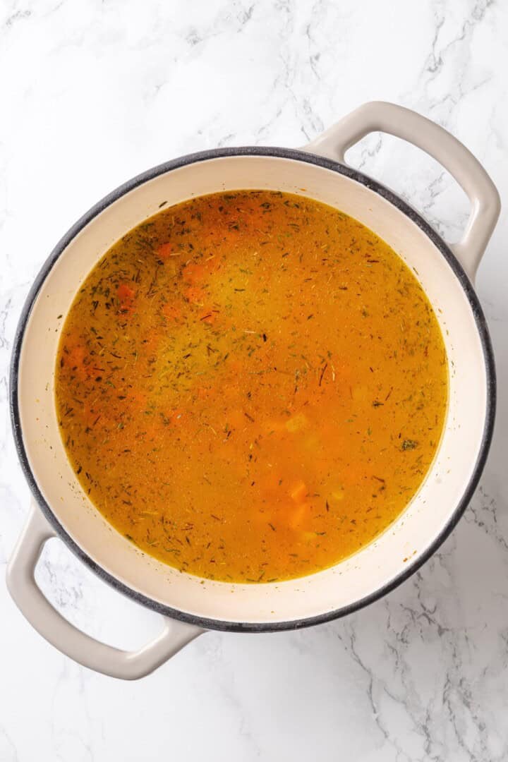 This vegan "chicken" and rice delivers all the cozy, savoury goodness of the meat-eater's version, no chicken required. Adding veggie broth to a Dutch oven with toasted rice and sautéed veggies.