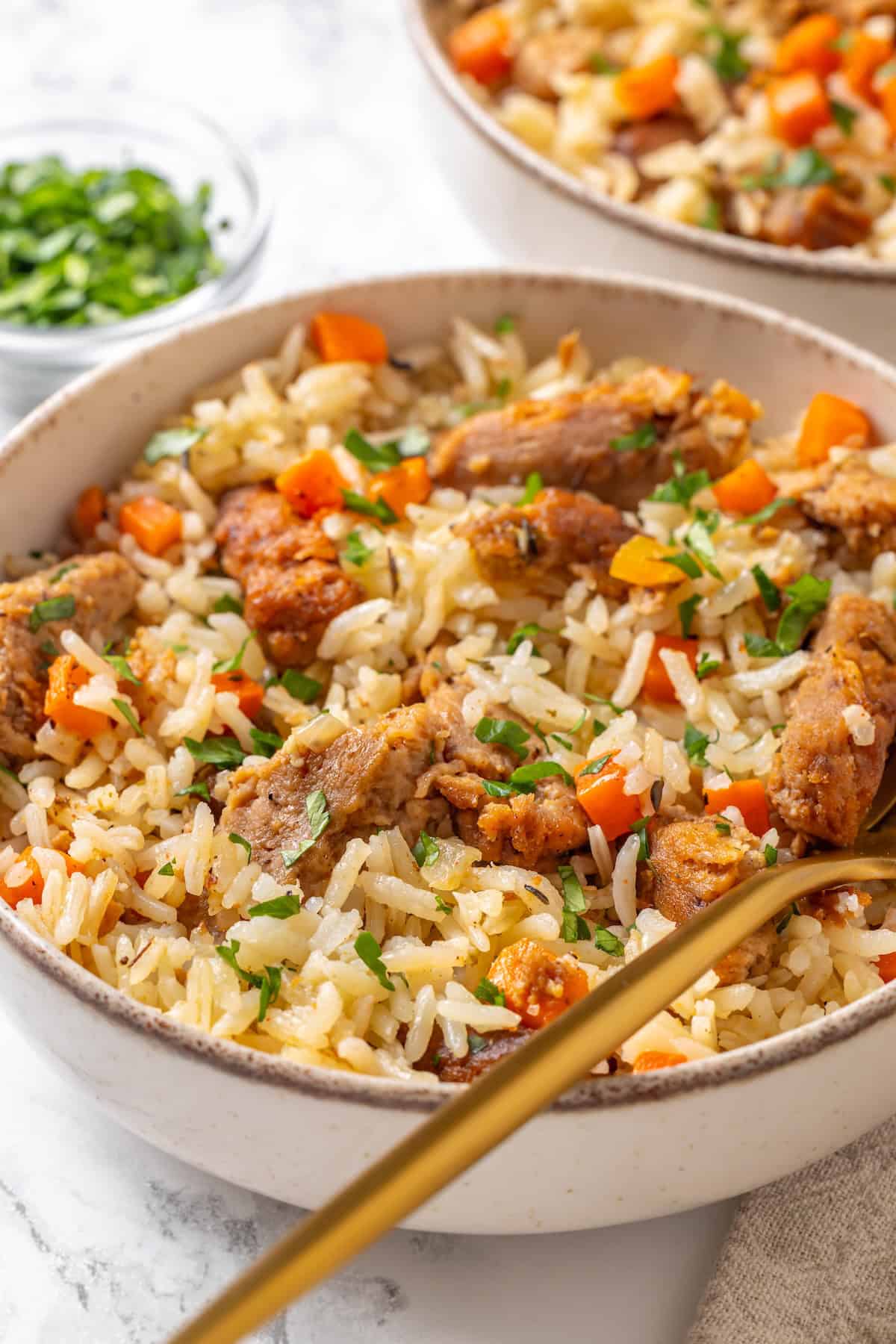This vegan "chicken" and rice delivers all the cozy, savoury goodness of the meat-eater's version, no chicken required. A bowl full of vegan chicken and rice.