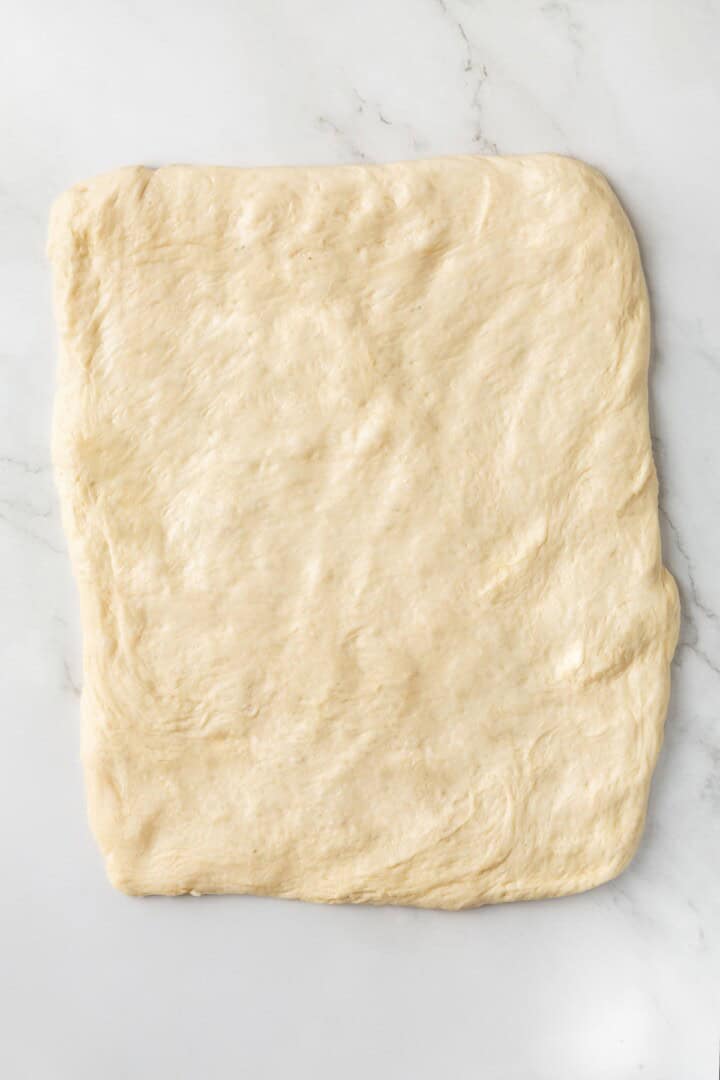 This easy vegan Sandwich Bread Recipe is a home baker's dream. Soft and pillowy with a subtle richness, it's a major upgrade to any sandwich. Vegan bread dough pressed into a rectangle.