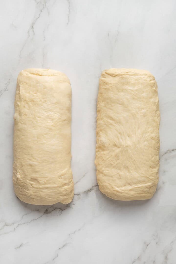 This easy vegan Sandwich Bread Recipe is a home baker's dream. Soft and pillowy with a subtle richness, it's a major upgrade to any sandwich. Two pieces of bread dough rolled into logs.