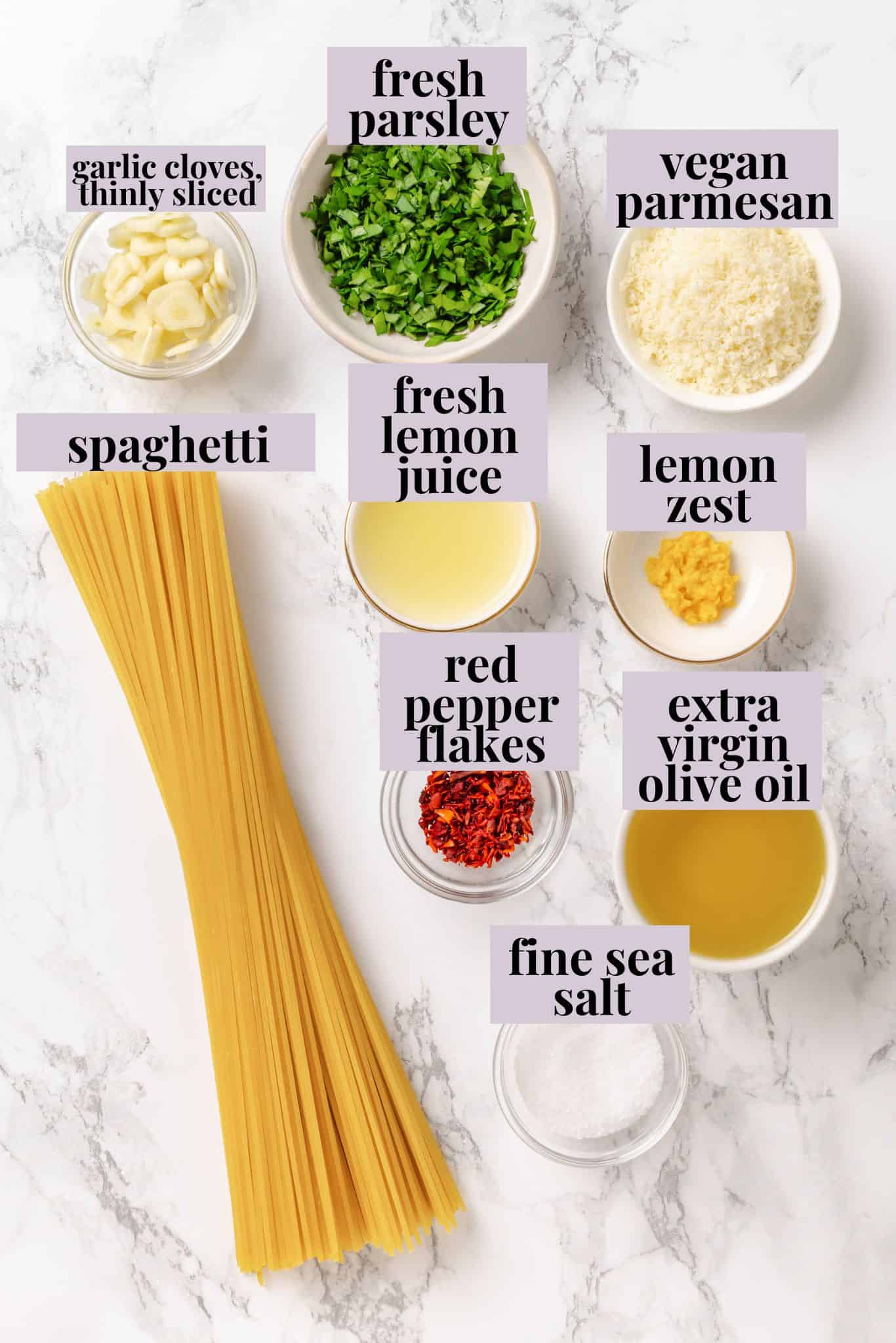 This easy aglio e olio features al dente spaghetti coated in a velvety garlic-infused sauce with a touch of heat from red pepper flakes. Labeled ingredients for spaghetti aglio e olio.