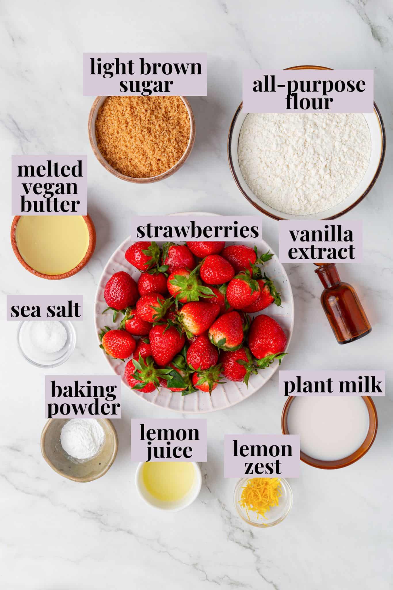 These Vegan Strawberry Muffins are top-notch. Tender, fluffy, and loaded with fresh fruit, they're the perfect way to start the day. Labeled ingredients for vegan strawberry muffins.