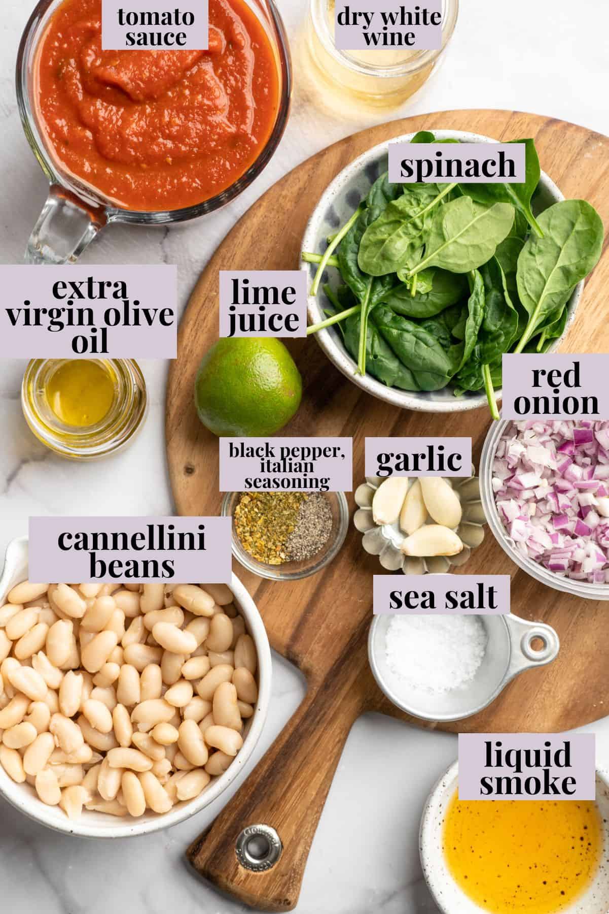 These 30-minute smoky white beans in tomato sauce are made with liquid smoke and plenty of garlic. They're amazing on toast for breakfast! Labeled ingredients for smoky white beans in tomato sauce.