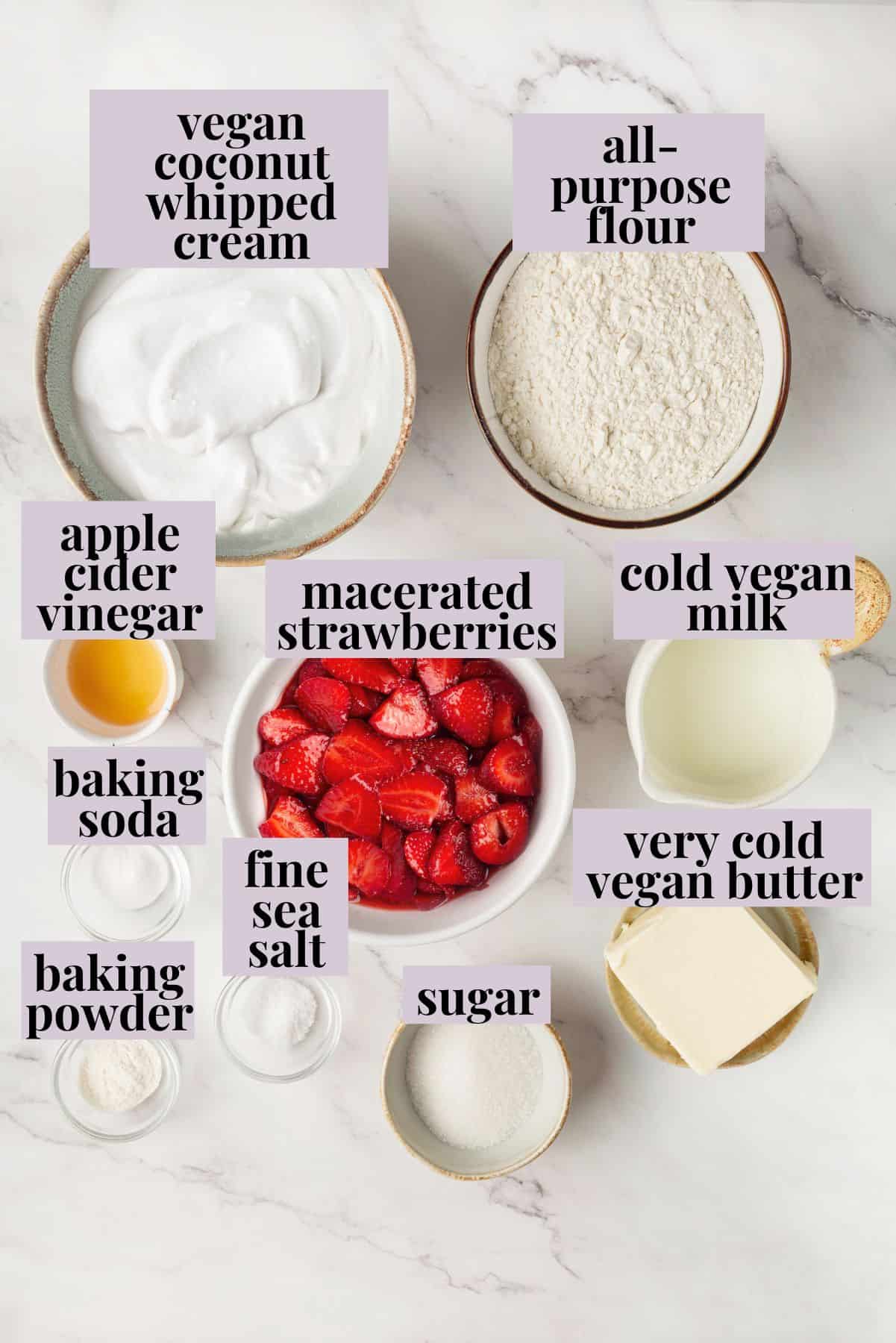 Strawberry shortcake recipe sandwiches sweet, syrupy macerated strawberries and fluffy vegan whipped cream between flaky homemade biscuits. Labeled ingredients for vegan strawberry shortcake recipe.