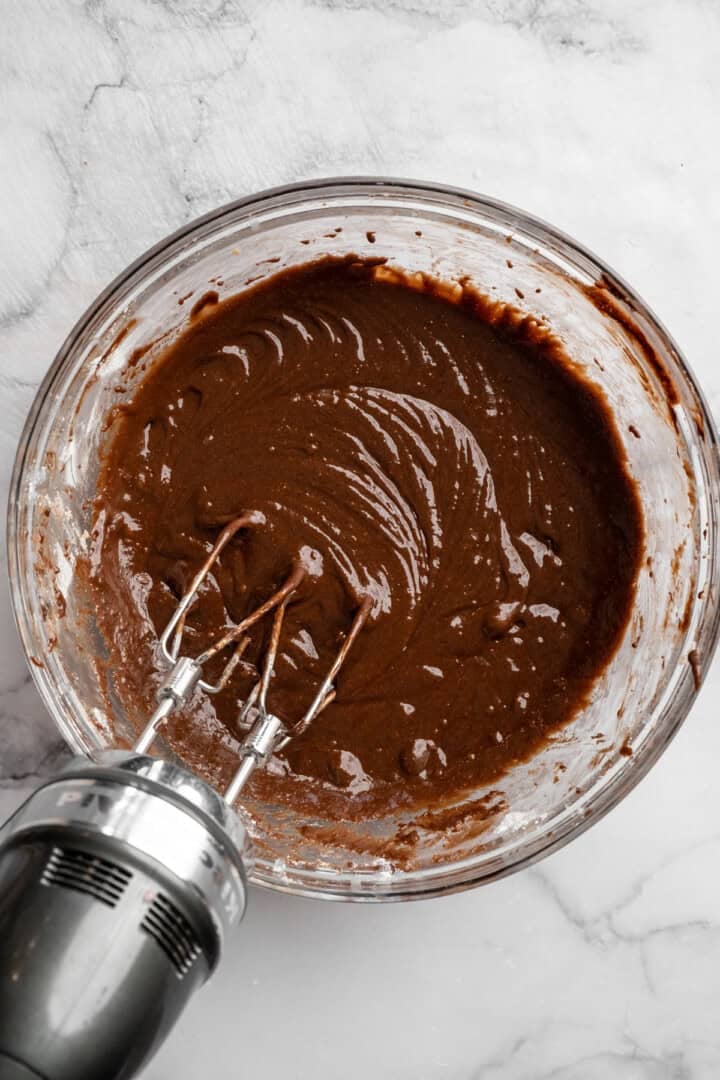 Peanut butter swirl brownies are wonderfully fudge-y, perfectly chewy, and complete with a salty ribbon of peanut butter swirled throughout. Whisking together the wet and dry ingredients with melted chocolate for brownie batter.