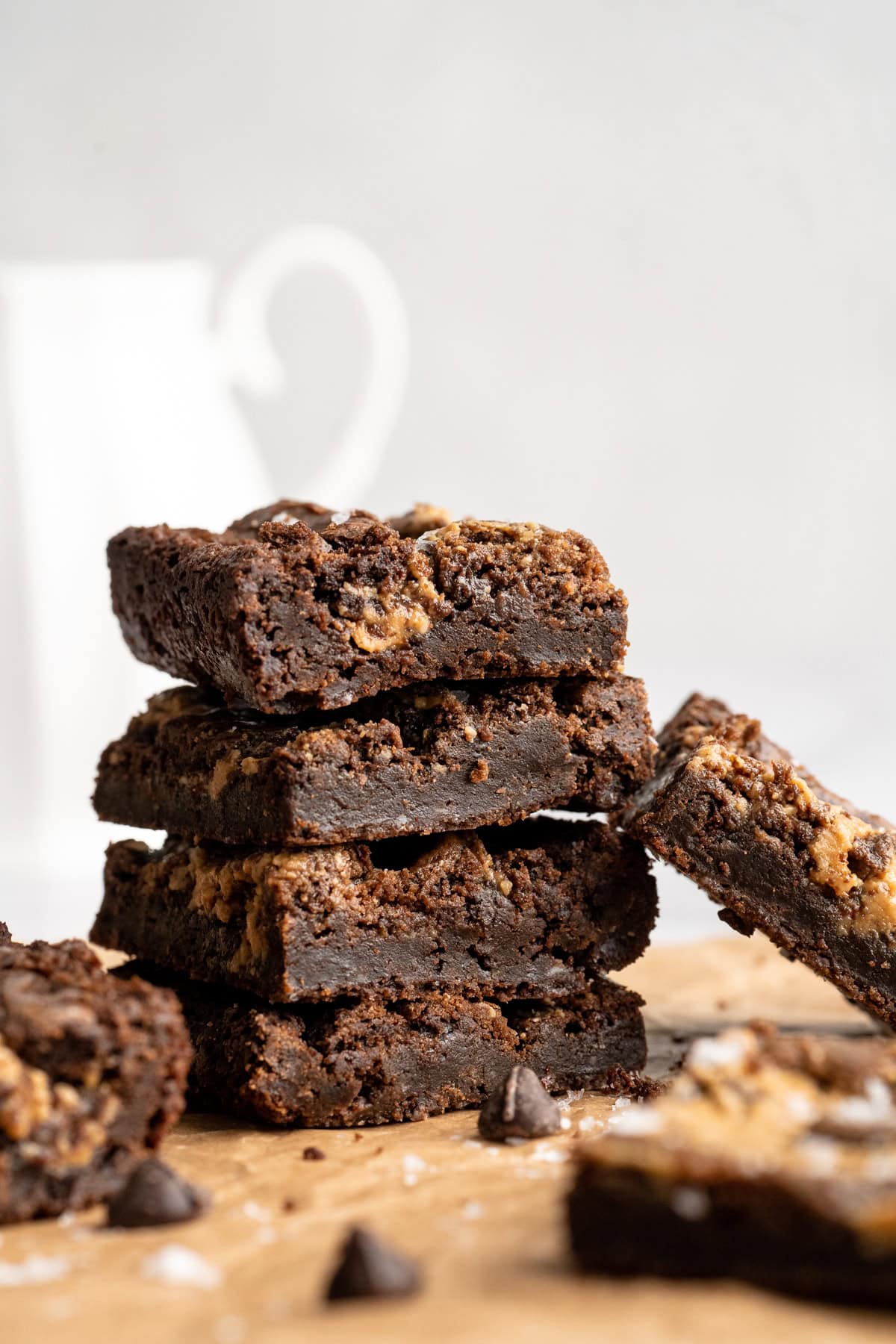 Peanut butter swirl brownies are wonderfully fudge-y, perfectly chewy, and complete with a salty ribbon of peanut butter swirled throughout. A stack of fudge-y peanut butter swirl brownies.