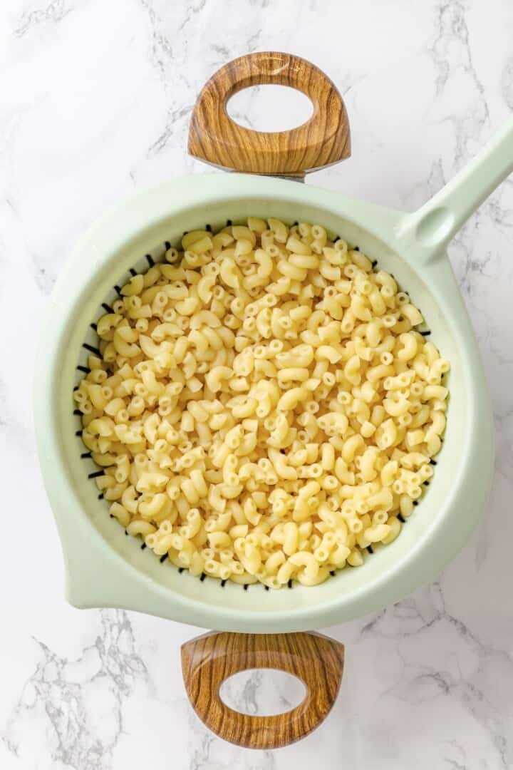 Creamy and crunchy, this macaroni salad recipe is made with crumbled tofu and a touch of kala namak for that old-school eggy flavor. Cooked elbow mac in a colander.