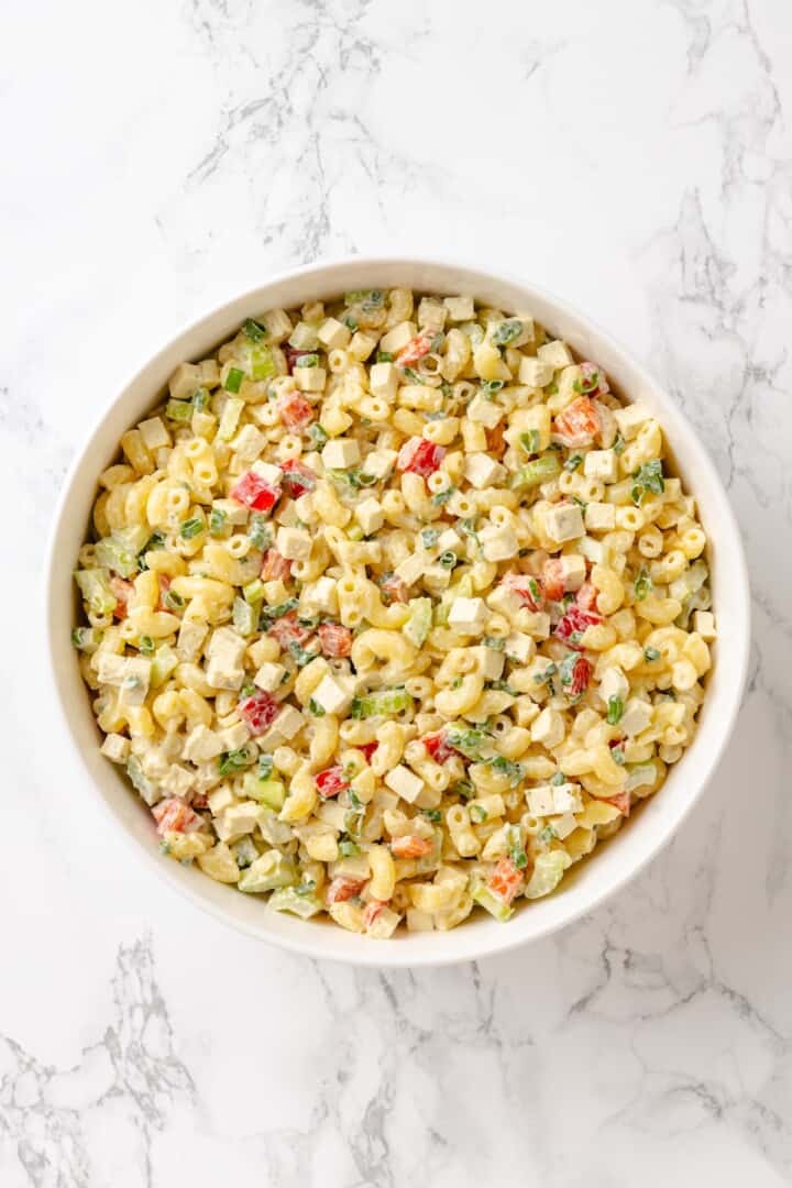 Creamy and crunchy, this macaroni salad recipe is made with crumbled tofu and a touch of kala namak for that old-school eggy flavor. Vegan mac salad, tossed with a creamy dressing.